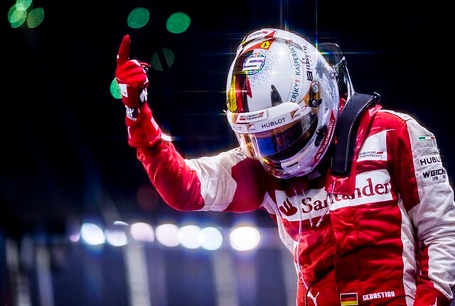 Sebastian Vettel of Germany and Scuderia Ferrari celebrates in Parc Ferme after winning the Singapore Formula One Grand Prix at Marina Bay Circuit on September 20, 2015 in Singapore, Singapore. (Photograph by Vladimir Rys)