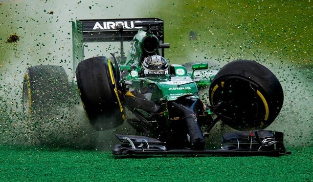 Kamui Kobayashi of Japan and Caterham gets off the track after his crash with Felipe Massa of Brazil and Williams during the Australian Formula One Grand Prix at Albert Park Circuit on March 16, 2014 in Melbourne, Australia. (Photo by Vladimir Rys)
